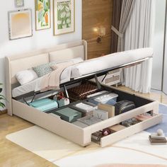 a bed with drawers underneath it in a room