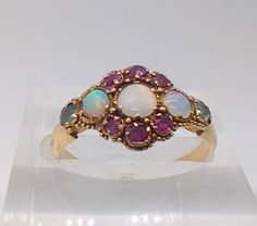 Fabulous Edwardian antique 9ct yellow gold ring set with gorgeous multi coloured opals, emeralds and rubies. Superb condition  Unmarked but has been tested as 9ct gold UK ring size M, US size 6 The front of the ring measures 1cm across the widest point and sits at 0.3cm off the finger Gold Ring Sets, Yellow Gold Ring, Gorgeous Jewelry, Heel Boots, High Heel Boots, Yellow Gold Rings, Ring Set, Ring Sets, Gold Ring