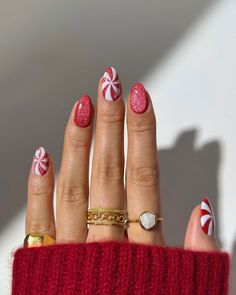 Add some festive cheer to your look with these adorable peppermint-inspired nails! The perfect mix of glittery red and crisp white swirls gives off cozy candy cane vibes, making them ideal for holiday parties or cozy nights in. Pair them with gold rings for an extra touch of elegance. 🎄💅 credits @thenaillologist   #HolidayNails2024 #PeppermintNails #FestiveManicure #ChristmasNails #WinterNailInspo #CandyCaneVibes #RedAndWhiteNails #GlitterNails #SeasonalNailArt #NailGoals #HolidayGlam #DIYNails #NailDesignIdeas #CozyWinterStyle #HandJewelryVibe  #candynails #rednails #holidaynails   #nails #nailinspo #nailart #naildesign #holidaynails #winternails #novembernails Candy Cane Nails, Red Christmas Nails, Pinterest App, Cute Christmas Nails, Christmas Gel Nails, Cat Eye Nails, Festival Nails, Xmas Nails, Christmas Nail Designs