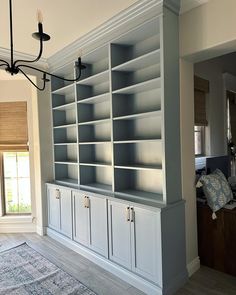 a large bookcase in the middle of a living room