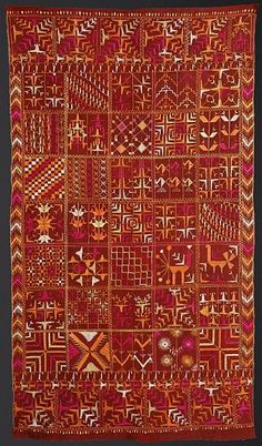 an orange and red cloth with geometric designs