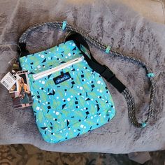 Cross Body Bag With Adjustable Rope Shoulder Strap, Main Compartment With Snap Closure, Front Zip Pocket, Back Flat Pocket, Padded Internal Pocket. Dimensions: 11” X 9” (2.5 L / 153 Cu In). Cross Body Strap Length: 44″ 50″. Fabric: 12oz Cotton Canvas. Nwt Kavu Bag, Cross Body Bag, Body Bag, Snap Closure, Confetti, Cross Body, Cotton Canvas, Zip Pockets, Cactus