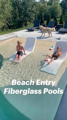 two children are sitting on lounge chairs in the pool with their dog standing behind them