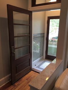 an open door leading to a bathroom and shower