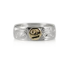 This ring has the main band in silver showing a side facing Orca Whale and a layer of 14K yellow gold soldered on top to depict the moon. It is a hand carved ring done by the Haida Gwaii artist Robert Cross. The width of the band is 1/4 inches. Orcas symbolize love of all types, representing romance, loyalty and close ties between family and friends.  It offers protection to travelers far from home, helping to guide your journey back.  In myth the Orca is closely linked to humans; it is said that those lost at sea are transformed into these whales and have gone to live in an underwater village.  Seen as the guardian of the ocean, the Orca is a strong spirit, which symbolizes longevity, resiliency and knowing that you are not alone. The Moon is seen in Northwest Coast mythology as a guardia Hand Carved Ring, Haida Gwaii, Creation Myth, Orca Whale, Orca Whales, Cross Hatching, Far From Home, Carved Ring, Jewelry Show