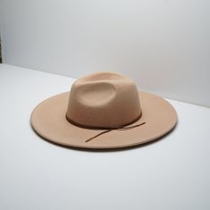 Be ready for whatever adventures life throws at you with the Lulus Take the Scenic Route Fedora Hat! Soft felt shapes this essential fedora with a semi-structured wide-brim and a traditional tear-drop crown. Matching leather string band adds just the perfect amount of something' extra! Internal drawstrings allow for the perfect fit. 100% Australian wool Spot Clean Please Read Before Purchasing: Our hats are made to fit average head sizes, the average adult head circumference to be 55cm (21 3⁄4 ) Fedora Hats For Women, Black Fedora Hat, Felt Shapes, Suede Hat, Wool Fedora Hat, Black Fedora, Men Cream, Rancher Hat, Fedora Hat Women