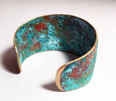 "Turquoise Patina Cuff/ Patina Cuff/ Patina Bracelet/ Verdigris Cuff Bracelet/ Boho Chic/ Statement Maker/ Rustic Patina Cuff Turquoise patina cuff that makes a statement! This brass cuff got its gorgeous turquoise color right here in my studio using an old patina recipe and letting it age for several days. When I felt the color had \"ripened\" to perfection, I etched around the edges to let the natural warmth of the brass peak through, then gave it several coats of eco-friendly sealant and a fi Blue Patina Cuff Bracelet As Gift, Blue Cuff Bracelet With Patina For Gifts, Blue Cuff Bracelet With Patina As A Gift, Blue Patina Cuff Bracelet As A Gift, Elegant Adjustable Cuff Bracelet With Patina, Elegant Adjustable Patina Cuff Bracelet, Turquoise Cuff Bracelet With Patina As A Gift, Turquoise Patina Cuff Bracelet As A Gift, Unique Patina Cuff Bangle Bracelet