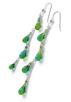 Dangling yet dainty, these fun silver and glass drop earrings conjure visions of flowering vines. Nickel-free Glass Drop Jewelry, Sterling Silver Drop Jewelry With Dangling Charms, Glass Drop Earrings With Matching Set, Silver Drop Jewelry With Dangling Charms, Glass Dangle Jewelry, Silver Jewelry With Dangling Long Drop Charms, Elegant Czech Glass Drop Jewelry, Sterling Silver Long Drop Teardrop Earrings For Party, Sterling Silver Long Drop Dangling Charms Jewelry