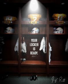 the locker room is filled with football jerseys and helmet display cases that read, your locker is ready