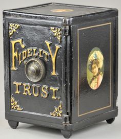 an old fashioned metal box with a portrait on the front and sides, painted black