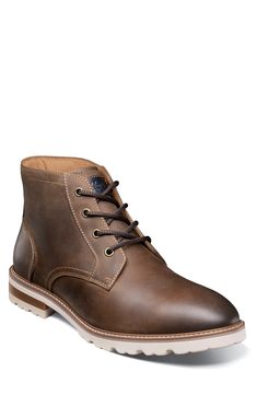 A stitched welt and sturdy lugs lend rugged appeal to a smooth leather lace-up boot with a padded collar and cushioned insole built for comfort. Lace-up style Removable, cushioned insole Leather upper/textile lining/rubber sole Imported Rugged Lace-up Work Boots With Stitched Sole, Rugged High-top Lace-up Boots With Goodyear Welt, Rugged Lace-up Goodyear Welted Boots, Rugged Goodyear Welted Lace-up Boots, Rugged Workwear Chukka Boots, Rugged Lace-up Desert Boots With Goodyear Welt, Casual Lace-up Boots With Goodyear Welt Moc Toe, Rugged Chukka Boots With Goodyear Welt, Casual Lace-up Boots With Goodyear Welt Construction