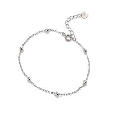 A versatile piece for layering, this gleaming sterling silver station bracelet features evenly spaced beads on a dainty cable chain. 0.12'' W x 7.09'' L with 1.18'' extender Lobster claw clasp Sterling silver Sterling Silver Adjustable Delicate Chain Bracelet, Classic Silver Bracelets With Delicate Chain, Classic Silver Bracelet With Delicate Chain, Silver Minimalist Rosary Bracelet, Minimalist Silver Rosary Bracelet, Silver Charm Bracelet With Delicate Adjustable Chain, Silver Adjustable Charm Bracelet With Delicate Chain, Elegant Silver Bracelet With Ball Chain, Silver Chain Bracelet With Extender