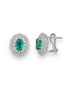 Glamorous, decadent oval stud earrings crafted in 14K white gold with emeralds and diamonds. Fine Jewelry Oval Emerald Earrings, Oval Pave Set Fine Jewelry Earrings, Oval Pave Setting Earrings In Fine Jewelry, Green Oval Diamond Earrings, Fine Jewelry Oval Earrings With Pave Setting, Oval Earrings With Pave Setting In Fine Jewelry Style, Oval Fine Jewelry Earrings With Pave Setting, Oval White Gold Earrings With Pavé Setting, Oval Stud Earrings