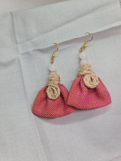 WOMEN FABRIC EARRING - Red Fabric Earring, Women Jewellery Gift, Earring for Women, Women Drop Earring, Fabric Women Earring, Earring Gift Discover the perfect blend of bohemian charm and modern elegance with our Women Fabric Earring. These drop earrings feature unique fabric elements and an ear hook design, making them a must-have for women who love distinctive and stylish accessories. Key Features: Boho Chic Appeal: Elevate your style with these fabric earrings that embody the free-spirited an Red Clip-on Earrings As Gift, Handmade Pink Earrings For Celebration, Handmade Red Clip-on Earrings For Party, Handmade Wrap Earrings As Gift, Red Beaded Drop Earrings With Latkans, Red Drop Earrings With Latkans, Bohemian Red Earrings, Red Beaded Earrings With Latkans For Gift, Bohemian Clip-on Earrings For Gift