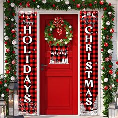 a red door decorated with christmas decorations and wreaths