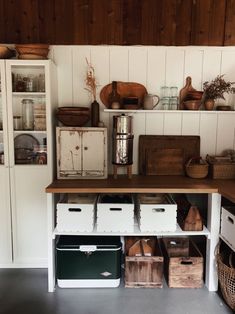 the shelves in this kitchen are filled with boxes and containers, baskets and other items