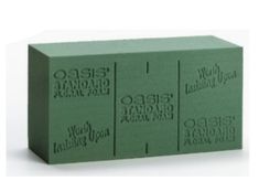 three green blocks with the words oasis island printed on them, each block is different sizes and colors