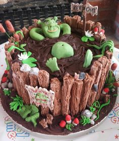 the cake is decorated with green and brown decorations