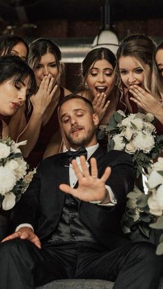 the groom is surrounded by his bridesmaids on their wedding day, and says