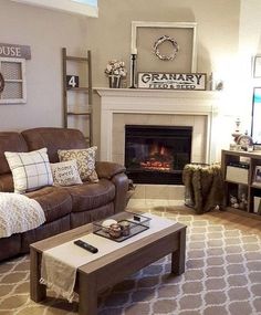 a living room filled with furniture and a fire place in the middle of the room