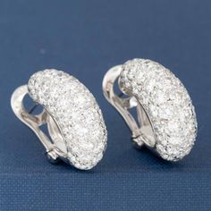 Who doesn't need huggie earrings studded with over 7cts of diamonds? I'm certainly raising my hand! This pair is both sexy and elegant at the same time, and sits on the lobes beautifully. A wonderful addition to any jewelry wardrobe, going beautifully from day to night. 18kt white gold Diamonds are estimated to be G/H colors & VS/SI1 clarities. GIA Standards Please see qualtiative report for more information. Luxury Diamond Earrings With Pave Setting For Everyday, Luxury Hand Set Round Diamond Earrings, Luxury Diamond Earrings With Pave Setting In Round Cut, Luxury Diamond Earrings With Pave Setting Round Cut, Luxury Round Cut Diamond Earrings With Pave Setting, Luxury Diamond White Huggie Earrings For Formal Events, Luxury Diamond Huggie Earrings For Formal Occasions, Luxury Huggie Diamond Earrings For Formal Events, Luxury Huggie Diamond Earrings For Formal Occasions