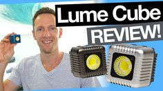 a man holding up a camera next to two light cubes with the words lume cube review