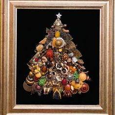 a painting of a christmas tree made out of buttons and other items in a gold frame