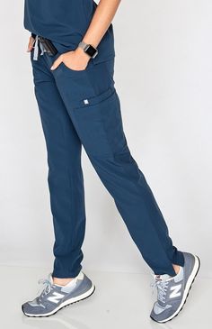 Why We Love This Polish your professional look with our most stylin' scrub pant yet. A tapered, skinny fit offers a contoured silhouette, equipped with our sign Figs Scrubs, Medical Outfit, Professional Look, Scrub Pants, You Deserve, New Color, Mom Jeans