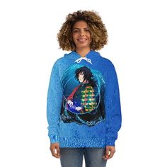 a woman wearing a blue hoodie with an anime character on it