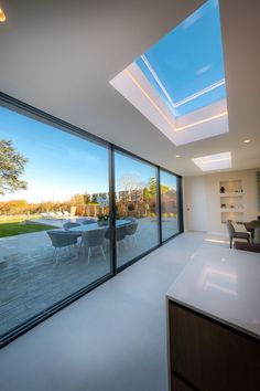 Three Track Sliding Doors Large Fixed Glass Windows, Track Sliding Doors, Sliding Glass Patio Doors, Contemporary Open Plan Kitchens, Modern Kitchen Renovation, Glass Pocket Doors, Sky House