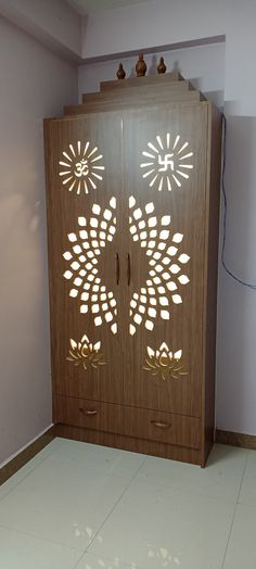 a large wooden cabinet with intricate designs on the doors