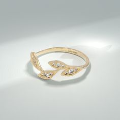 Embrace the beauty of nature with the Diamond Iconic Leaf Ring, a stunning symbol of growth and everlasting love. This exquisite ring is meticulously crafted in 14k solid gold and features a delicate vine design adorned with brilliant diamonds. The ring can be made with yellow, rose, or white gold, please choose your size from the dropdown menu options above. 𝐑𝐢𝐧𝐠 𝐃𝐞𝐭𝐚𝐢𝐥𝐬: ❥ Solid gold, available in 10, 14 & 18 karats. ❥ Gold Color Options: White Gold, Yellow Gold, Rose Gold ❥ Band Wi Elegant Recycled Gold Stackable Promise Rings, Nature-inspired Jewelry With Single Cut Diamonds For Anniversary, Nature-inspired White Gold Diamond Ring, Elegant Recycled Gold Diamond Promise Ring, Fine Jewelry Midi Rings In Recycled Gold For Weddings, Recycled Gold Fine Jewelry Midi Rings For Wedding, Elegant Diamond Promise Ring In Recycled Gold, Nature-inspired Recycled Gold Wedding Ring, Nature-inspired Diamond Promise Ring