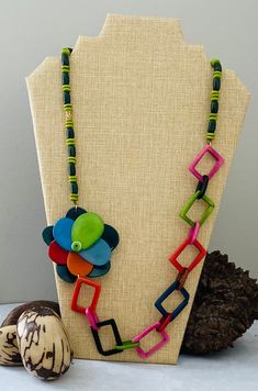 Handmade in Ecuador Necklace Length: 15 Inches Material: Tagua Nut Gold Handmade Clasp Due to this item being handmade and the nature of the Tagua Nut the size and the color may vary from piece to piece Nature-inspired Green Jewelry With Wooden Beads, Handmade Multicolor Beaded Necklaces, Nature-inspired, Handmade Multicolor Nature-inspired Beaded Necklaces, Nature-inspired Multicolor Beaded Necklaces As Gift, Unique Multicolor Flower Necklaces, Unique Multicolor Flower Necklace, African Necklace, Tagua Nuts, Jade Jewelry