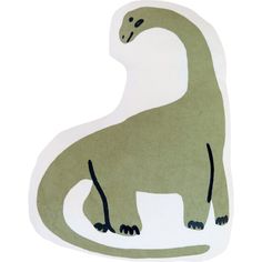 a green and white dinosaur shaped pillow on a white background