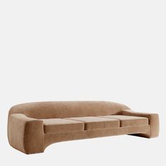 a brown couch sitting on top of a white wall