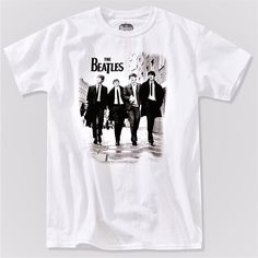 a white t - shirt with an image of three men in suits walking down the street