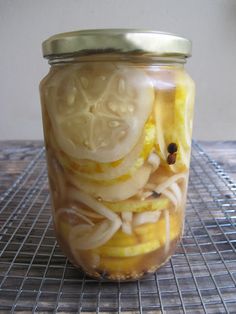 a jar filled with food sitting on top of a metal rack