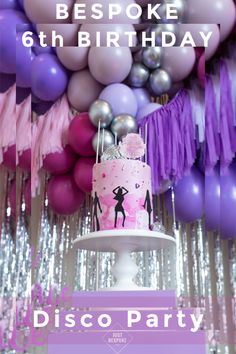 a birthday party with balloons, streamers and cake