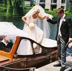 the bride and groom are getting ready to go on their wedding day in a boat