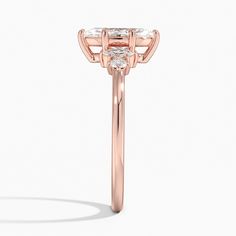 Marquise Cut Miroir Diamond Engagement Ring - 14K Rose Gold. Round and marquise diamonds are reflected on either side of the center stone in this unique five stone ring with a modern yet traditional feel (1/6 total carat weight). 
 
 The Reflections Collection, a line of exclusive Brilliant Earth designs, features dynamic jewelry united by motifs that reflect the symmetry of mirroring images found in nature. Formal Three Stone Rose Gold Ring, Elegant Rose Gold Three Stone Ring, Formal Rose Gold Three Stone Ring, Luxury Marquise Cut Rose Gold Ring, Luxury Marquise Cut Rose Gold Wedding Ring, Luxury Rose Gold Marquise Diamond Ring, Luxury Rose Gold Marquise Cut Ring, Luxury Cluster Ring With Center Stone In Rose Gold, Luxury Rose Gold Marquise Cut Wedding Ring