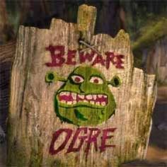 a wooden sign with graffiti on it that says beware of the ojite