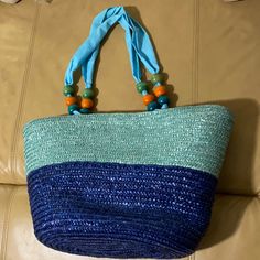 New Without Tags Straw Beach Bag Shades Of Blue With Fabric Straps/Handles With Decorative Wood Beads. Measures Approx 12” Drop, 20” W X 8” Deep X 11” Tall. Fully Lined Inside Bag. Very Nice Straw Bag. Inside Wall Pocket, Snap Closure. Blue Bohemian Bags With Braided Handles, Blue Rectangular Bags For Vacation, Blue Rectangular Bag For Vacation, Summer Beaded Shoulder Bag For Shopping, Blue Bohemian Shoulder Bag For Vacation, Bohemian Blue Bags With Braided Handles, Green Beaded Bag For Summer, Blue Summer Shoulder Bag For Shopping, Summer Green Beaded Bag