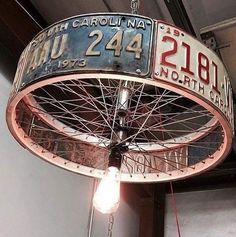 an old bicycle wheel hanging from the ceiling