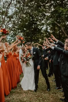 the bride and groom are surrounded by their wedding party