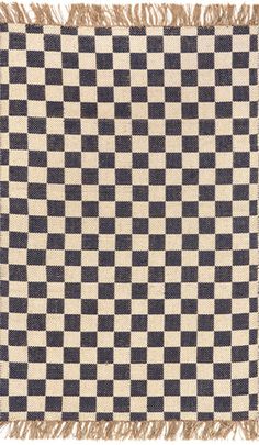 a black and white checkered rug with fringes