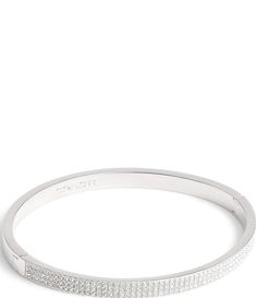 From COACH, the Crystal Pav Bangle Bracelet features:Bangle braceletBrass/glass crystalHinge closureApprox. 7" LImported. Coach Metal Bangle Jewelry, Modern Coach Jewelry For Formal Occasions, Coach Silver Bangle Bracelet, Coach Silver Bangle Bracelets, Coach Formal Bangle Jewelry, Coach Adjustable Bangle, Adjustable Coach Bangle, Silver Coach Bracelet As Gift, Silver Coach Bracelet Gift