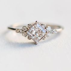 an engagement ring with three diamonds on it