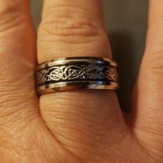 Please Let Me Know What Size You Need Before You Order, So I Can Make Sure That I Have It And I'll Create You A Seperate Post. Could Be Worn As Thumb Ring! Titanium Silver Tone Wedding Bands With A Filigree Center That Has A Blackish Back Ground. Very Durable! These Are Around $100- $150 In Stores. New, Never Worn. Smoke Free. Thanks And God Bless! Camo Bracelet, Layered Cross Necklace, Football Necklace, Skeleton Necklace, Natural Emerald Rings, Back Ground, Gem Necklace, Thumb Ring, Skull Necklace