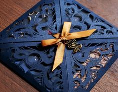 a close up of a card with a bow on it's side and an orange ribbon around the edge