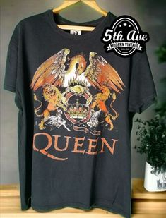 100% cotton single stitched Queen color hand screened t-shirt #Queen #QueenBand #QueenMusic #QueenFan #RockMusic #ClassicRock #MusicMerch #BandTee #VintageTshirt #MusicFashion #RockFashion #BandMerch #RockStyle #TshirtLove #MusicLovers #RockAndRoll #TshirtCollector #QueenForever #QueenFanArt #QueenMemorabilia Queen Merch, Queen T Shirt, Vintage Band Shirts, Vintage Band T Shirts, Stitch T Shirt, Queen Tshirt, Anime Tees, Movie Tees, Mens Vintage